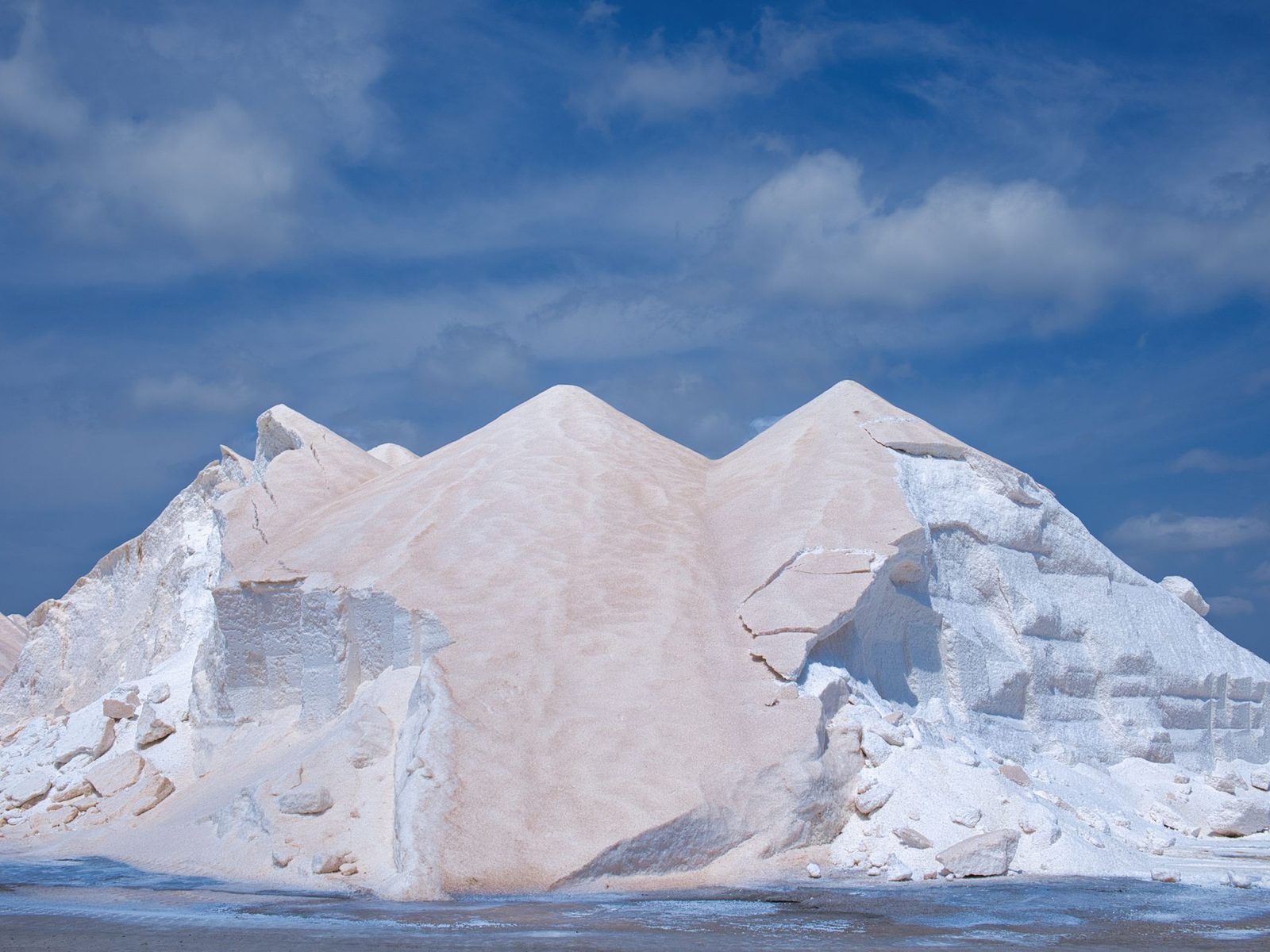 Bulk stockpile of white mineral powder